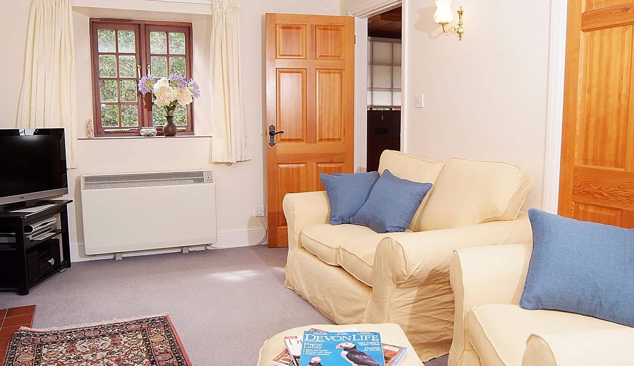 The sitting-room with its comfy sofa and chairs.