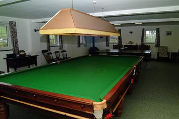 The full-size billiard table can provide hours of enjoyment.