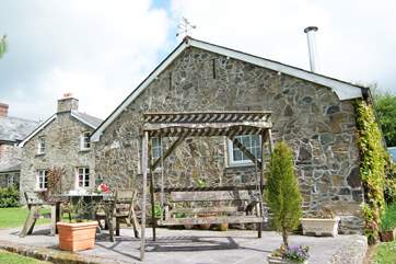 First floor Forda Hayloft is on the left (the top floor windows) with a swing on the patio in front of the games-room.