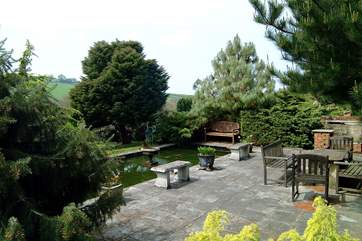 One of the two pretty ponds, providing a secluded sitting-area in the grounds.
