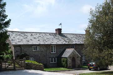 The front of the main house as you pull into the gravelled driveway.