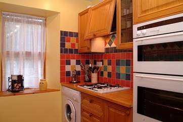 The kitchen is small but well-equipped.