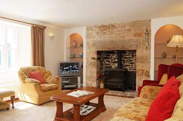 The sitting-room is spacious and filled with light.