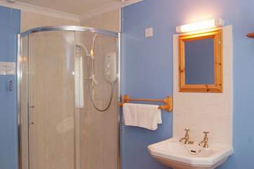 There is a separate shower cubicle in the bathroom.