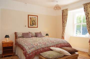 Bedroom 1 is very spacious and provides a cot for babies.