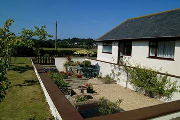A rear view of the property and the sheltered sunken garden.