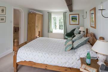 The master bedroom is both large and dual-aspect, with views over the garden at the back and the castle to the front.