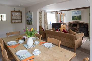 The sitting-room is very comfortable with cosy underfloor heating and doors that open onto the enclosed garden.
