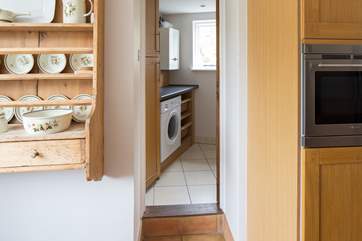 Up one step from the kitchen takes you to the utility room and the downstairs cloakroom.