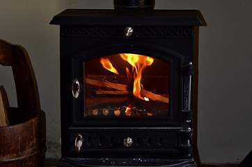 The glowing wood-burner.