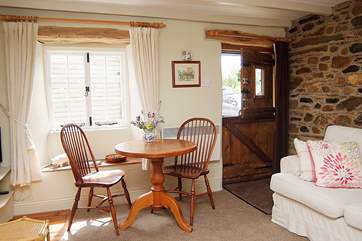 A stable-door opens into this lovely cottage, and a deep sofa to snuggle up in welcomes you on arrival.