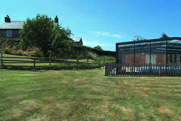 Looking back towards the cottage from the large grassed area around the pool (beyond the Owner's farmhouse on the left).