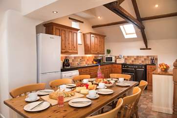 The large farmhouse table will make mealtimes a treat.