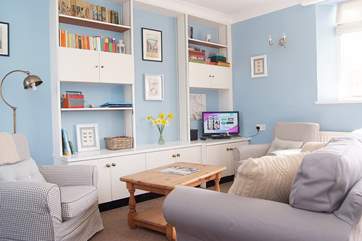 The sitting-area has a comfortable sofa and chairs.
