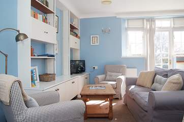 There is a door from the sitting-area out to the enclosed lawned garden.