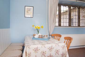 There is plenty of space for everyone around the dining-table.