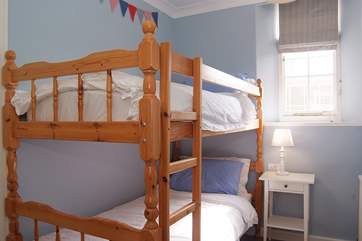 The cosy bunk-room is ideal for children.