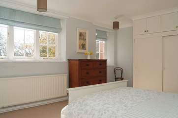 Two big windows let lots of light into Bedroom 1.