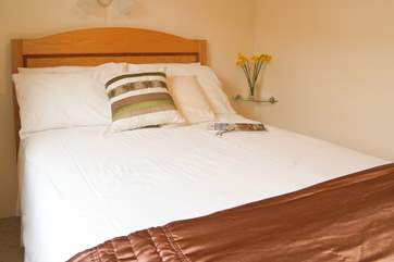 The ground floor double bedroom (Bedroom 1) is across the hall from the bathroom.