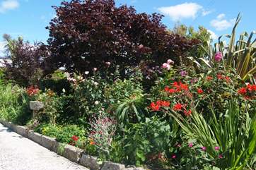 The flower borders are full of colour in summer.