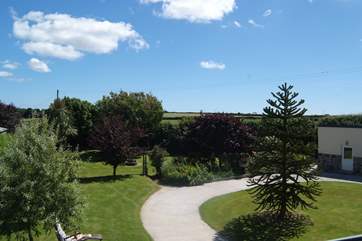 The view across the garden from the master bedroom's window, with the games-room on the right.