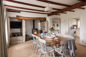 The dining-room links straight through to the kitchen for sociable meals, there is also a sofa in this room too.
