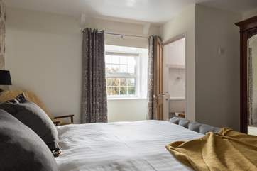 The master bedroom has pretty views over the garden.