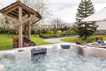 What a spot! Relax in the hot tub looking over the fabulous garden.
