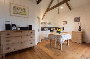 A step down from the living area to kitchen and dining area.