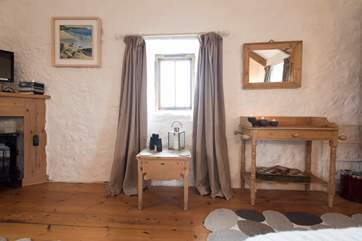 The bedroom area is on the right hand side of the photo.