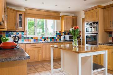 The wonderfully spacious kitchen has a utility 'cupboard' next door, which houses the washing machine and tumble-drier.