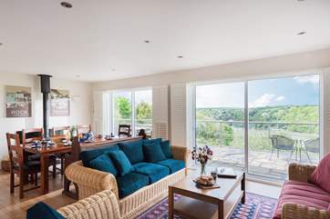 The big kitchen/dining-room also has a sitting-area, with two patio doors making the most of the glorious views.
