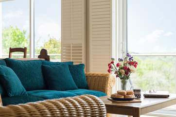 Relax and watch the chef at work from the comfort of one of the sofas.