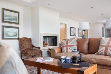 Comfy sofas around a modern built-in wood-burner are a great combination.