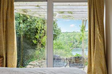 Bedroom 4 has doors onto the patio and shares the wonderful view.