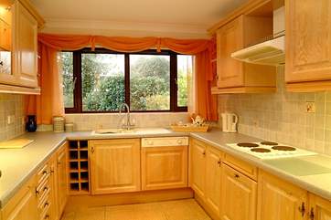 The well appointed kitchen has views of the garden.
