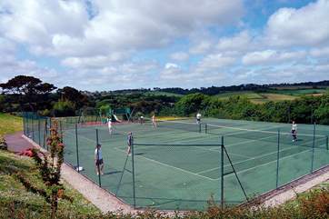 The tennis courts are surrounded by wonderful views.