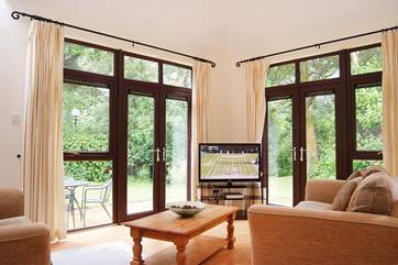 Light floods into the sitting/dining-room.