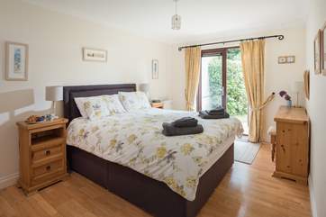 The master bedroom (Bedroom 1) has double doors opening to the garden.