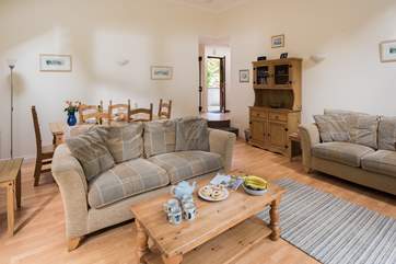 The open plan living space is flooded with natural light.