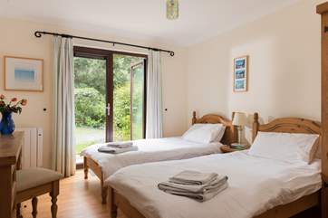 The twin bedroom (Bedroom 2) also opens to the garden.