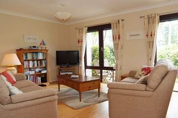 The sitting/dining-room has doors out to the terrace.