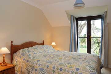 The master bedroom has a king size bed and a Juliette balcony (Bedroom 1).