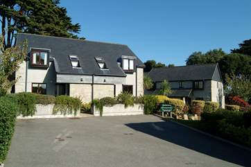 Rosemary Cottage is the right-hand property of the semi-detached houses on the left.