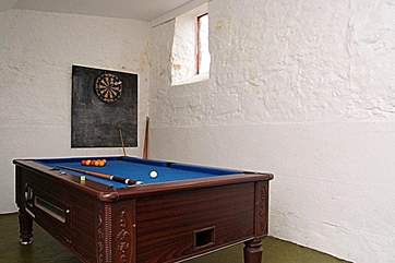 The coin-operated pool table in the outside games-room.