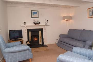 The cosy sitting-room with its traditional beamed ceiling.