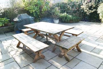 The enclosed patio-area is very sunny and ideal for a barbecue.