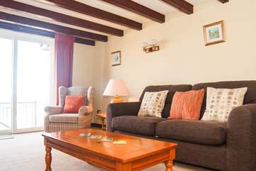 The sitting-room has doors out to the balcony.