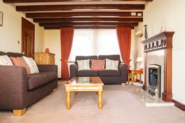 Comfortable sofas, a coal-effect gas fire and TV with Freesat...all perfect for family film nights.