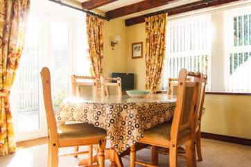 The dining-area has doors out to the patio.